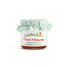 Jar of Sidehill Farm Mango Habanero jam with a green checkered cloth on a white background