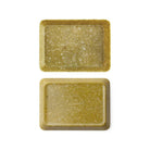 Two small mustard yellow marbled desk tray on white background