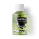 A bottle of Marvis mouthwash concentrate laying on white background.