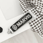 Amarelli Licorice Marvis Toothpaste tube open on bathroom sink ledge.