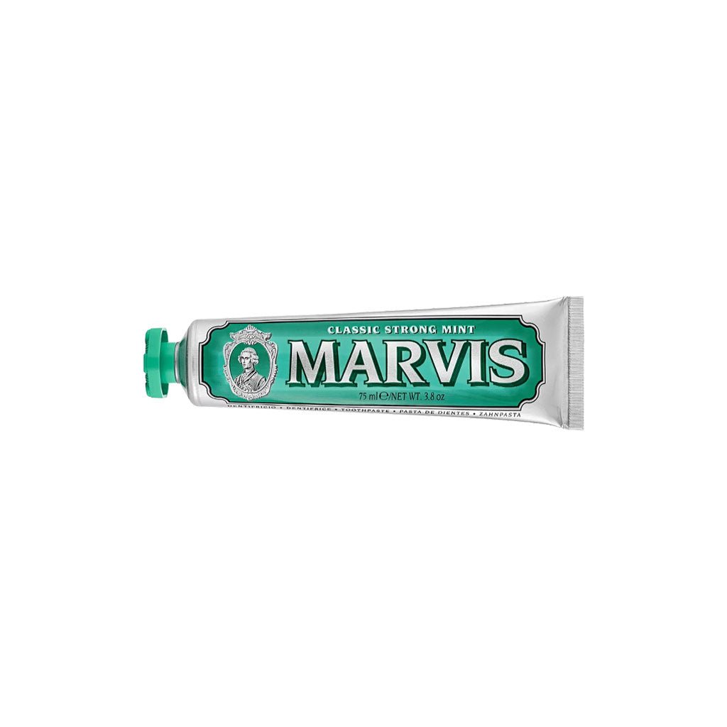 Green classic strong mint marvis toothpaste tube on white background
