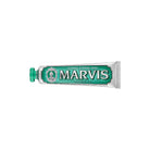 Green classic strong mint marvis toothpaste tube on white background