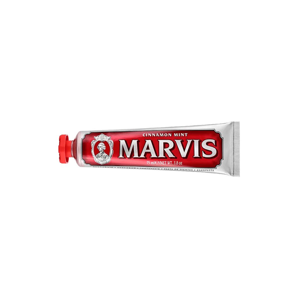 Red cinnamon mint marvis toothpaste tube on white background