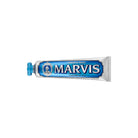 Blue aquatic mint marvis toothpaste tube on white background