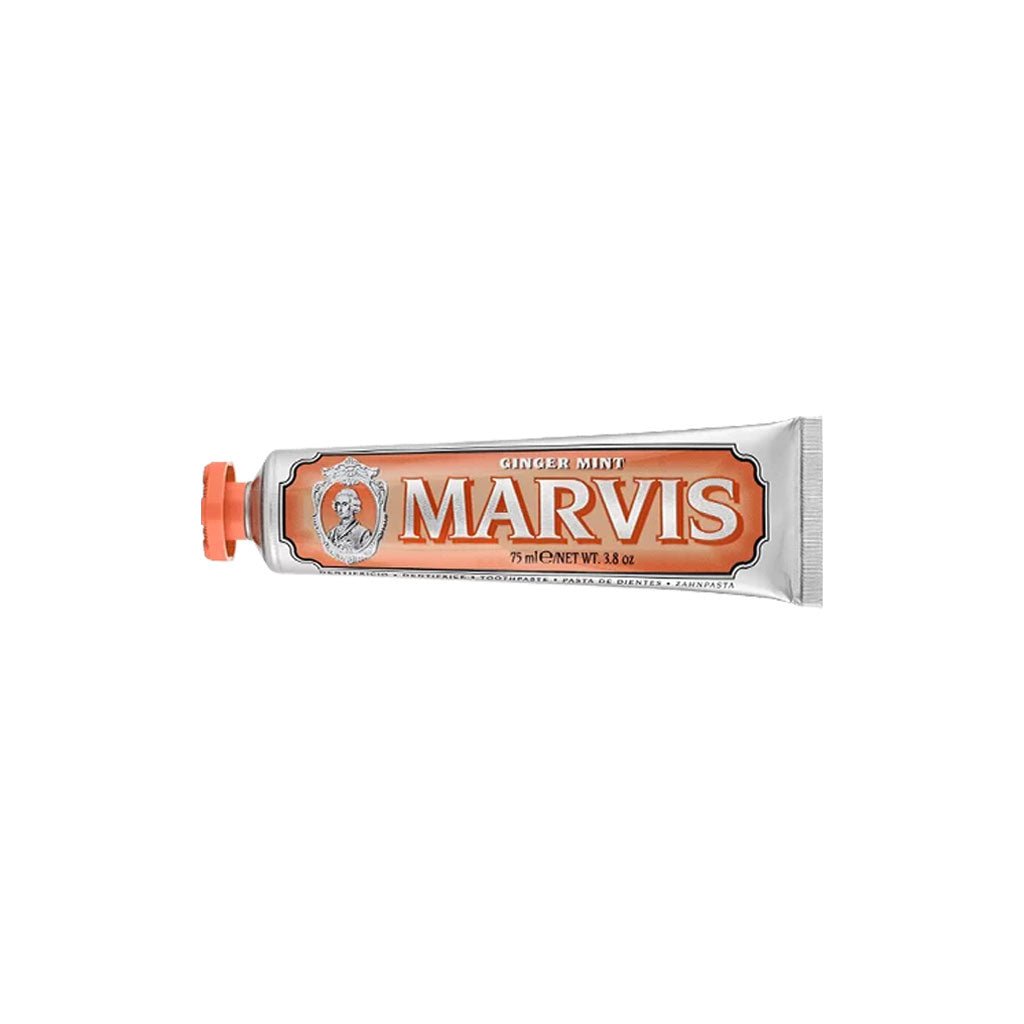 Orange ginger mint marvis toothpaste tube on white background