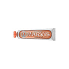 Orange ginger mint marvis toothpaste tube on white background