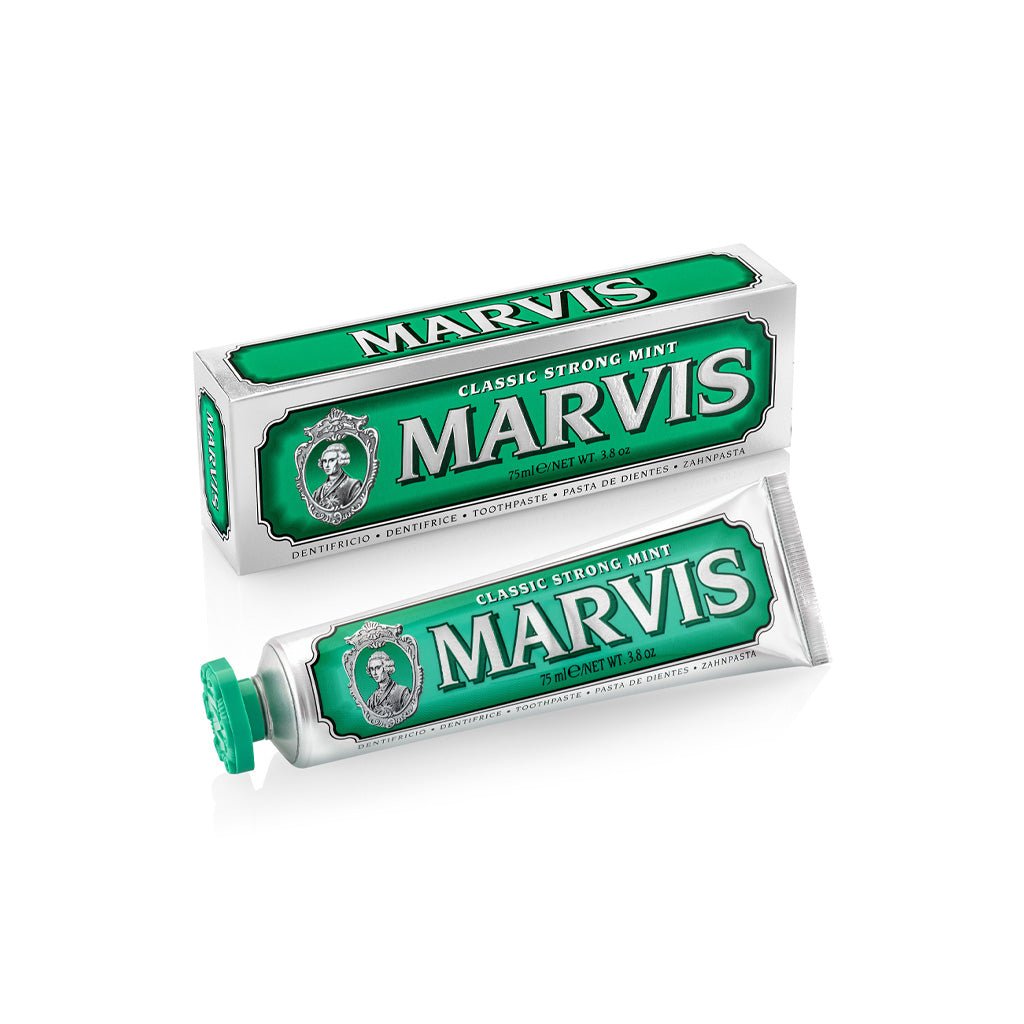 A tube and box of Marvis Classic Strong Mint toothpaste on a white background.