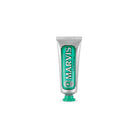 Travel-size tube of Classic Strong Mint Marvis toothpaste.