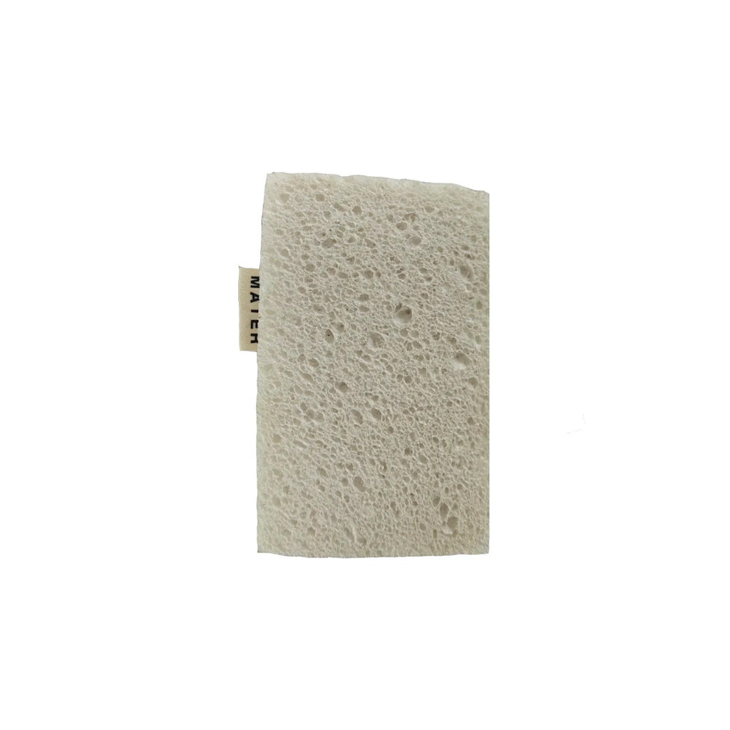 Foam underside of mater kitchen sponge on white background