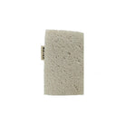 Foam underside of mater kitchen sponge on white background