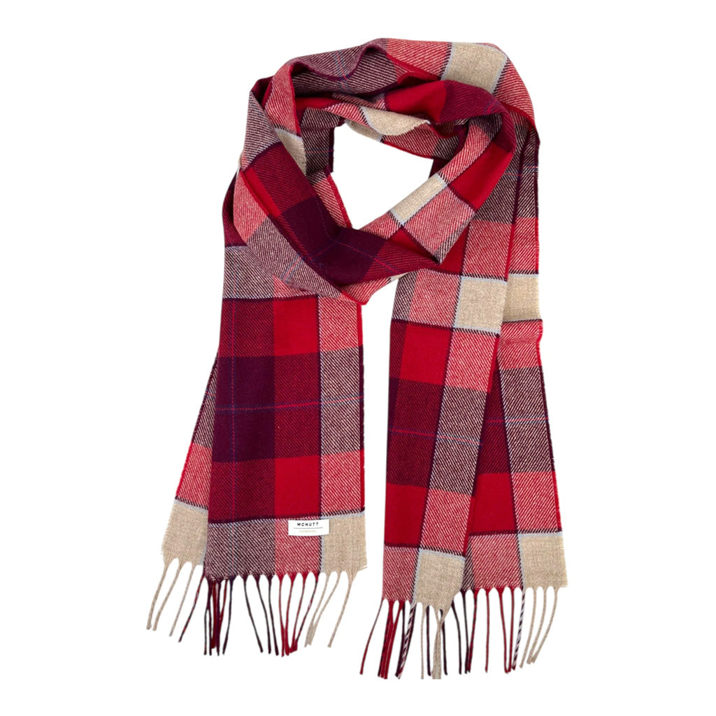 A plaid lambswool scarf with red and pink tones on white background.