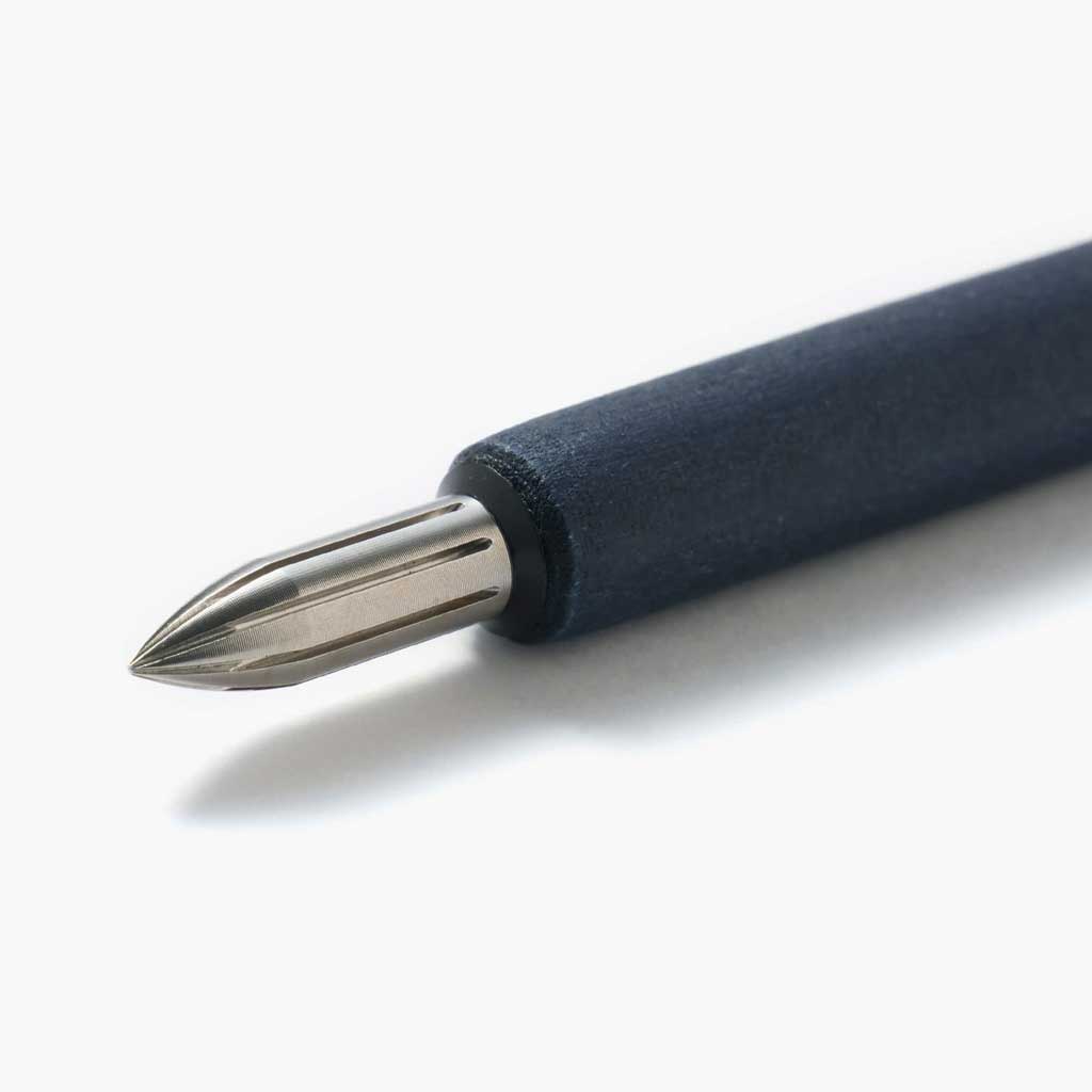 Blue wooden dip pen with steel nib on white surface