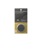 A round black carton opener by Midori in packaging on white background