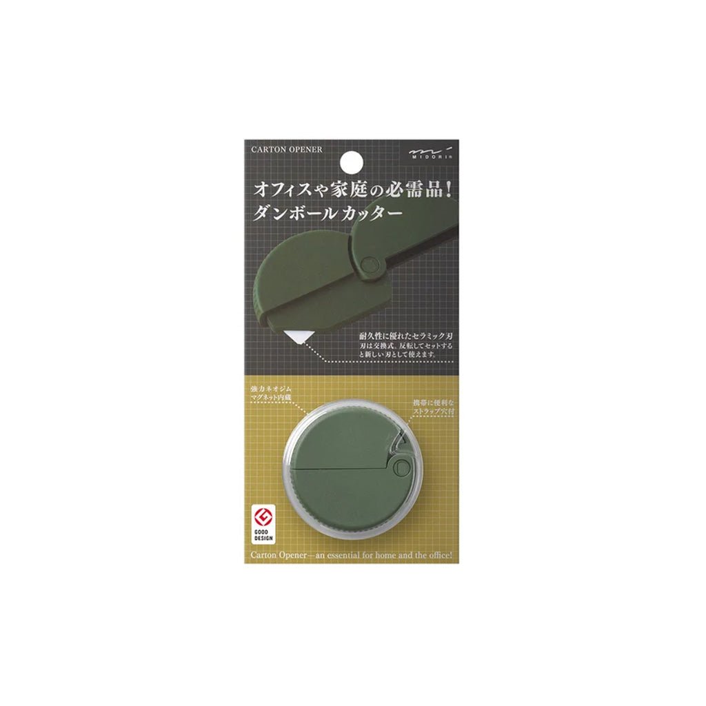 A round green khaki carton opener by Midori in packaging on white background