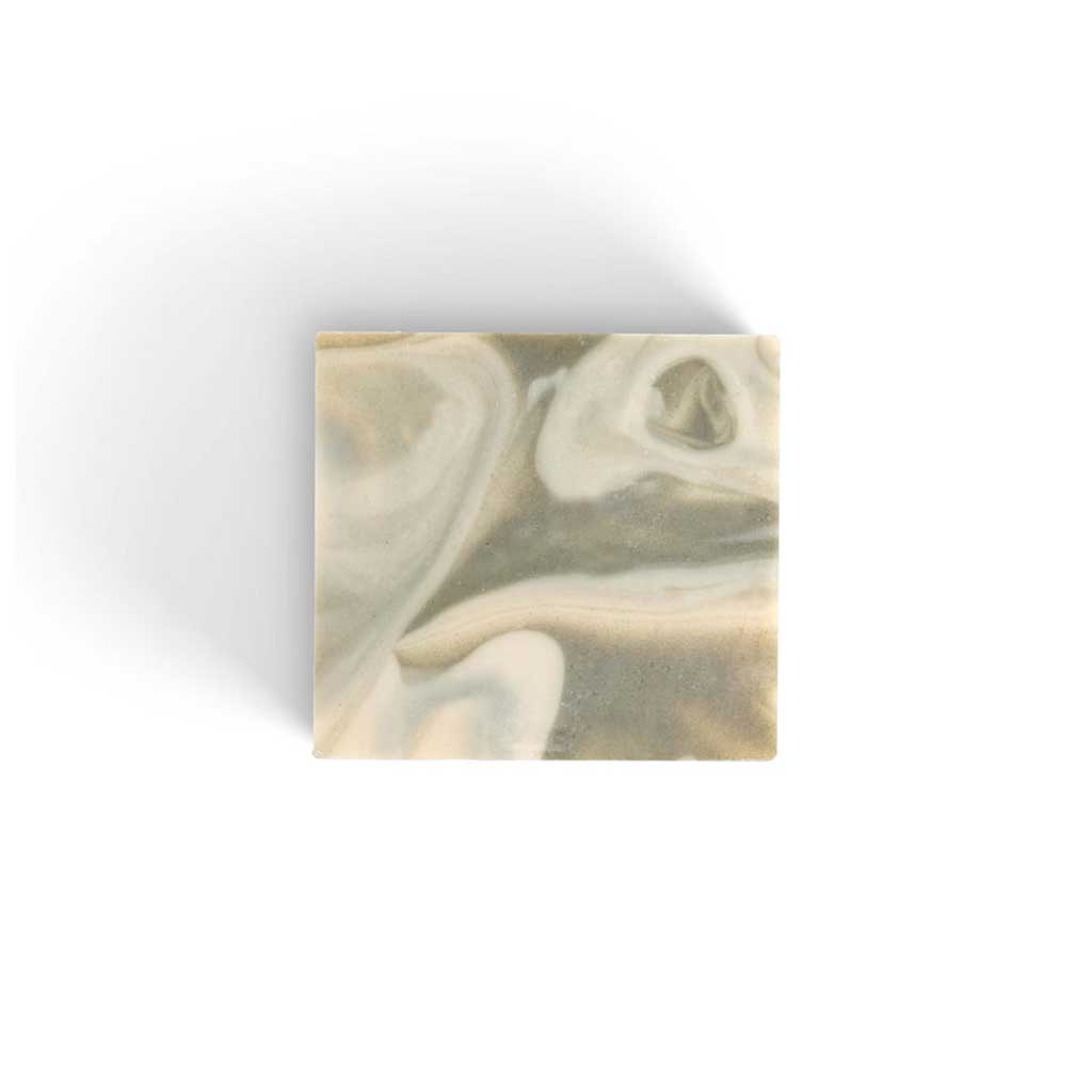 Marbled bar of SallyeAnder milk and mint soap on white background