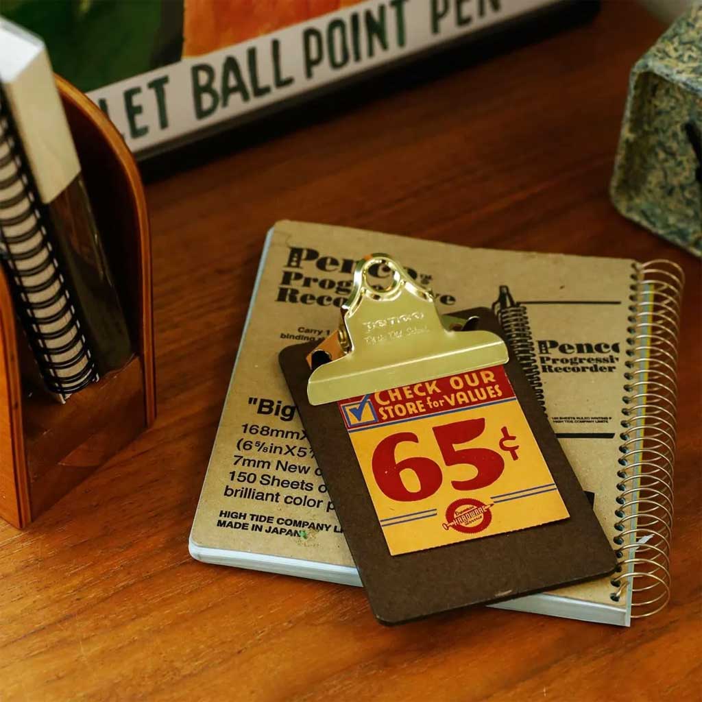 Small mini clipboard with vintage ephemera clipped 