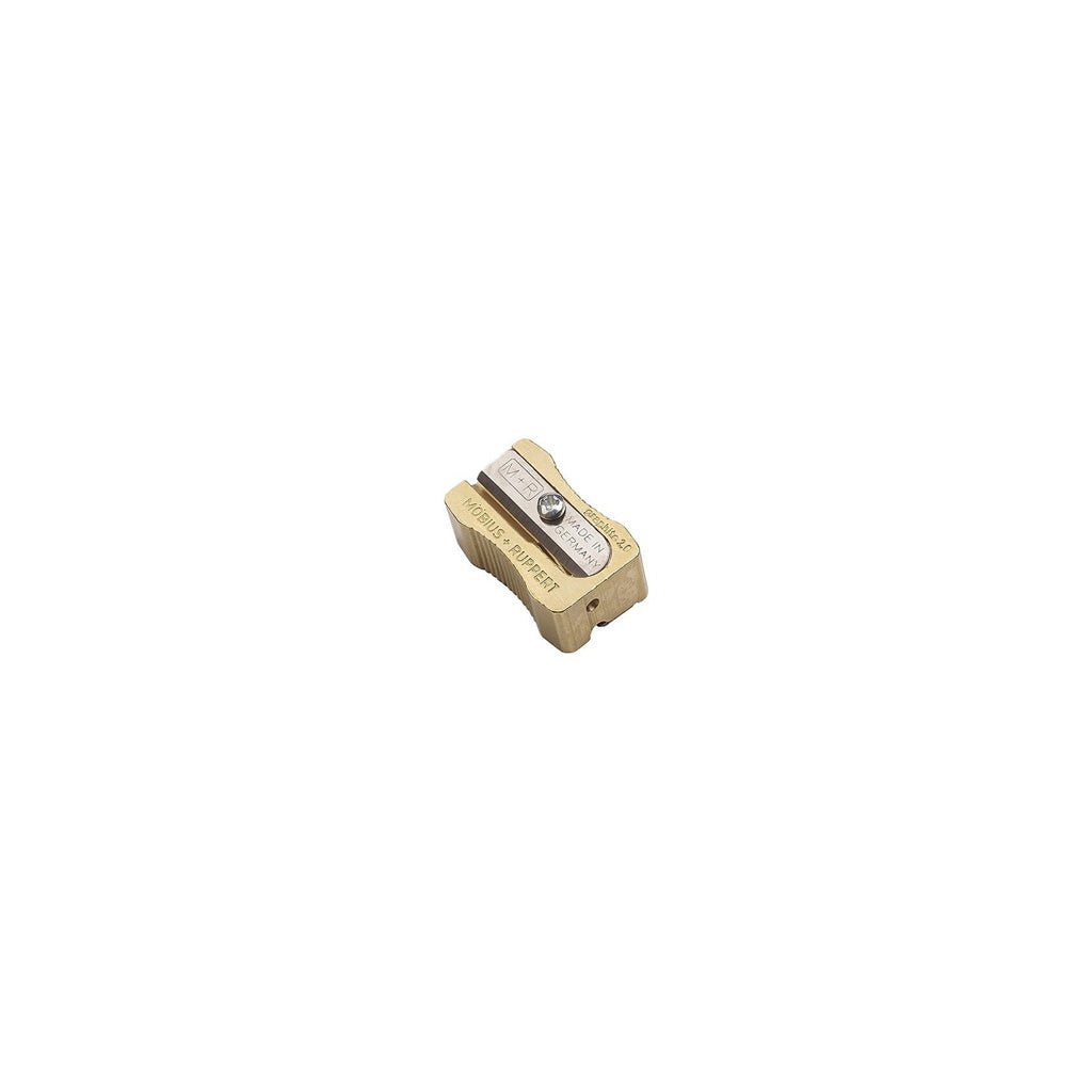 Brass pencil sharpener on white background