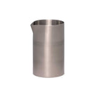 Stainless steel banded cocktail mixtin with spout on white background