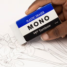 Tombow Mono plastic eraser being used on a drawing with floral lines.