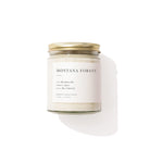 Candle jar labeled 'Montana Forest' on a white background