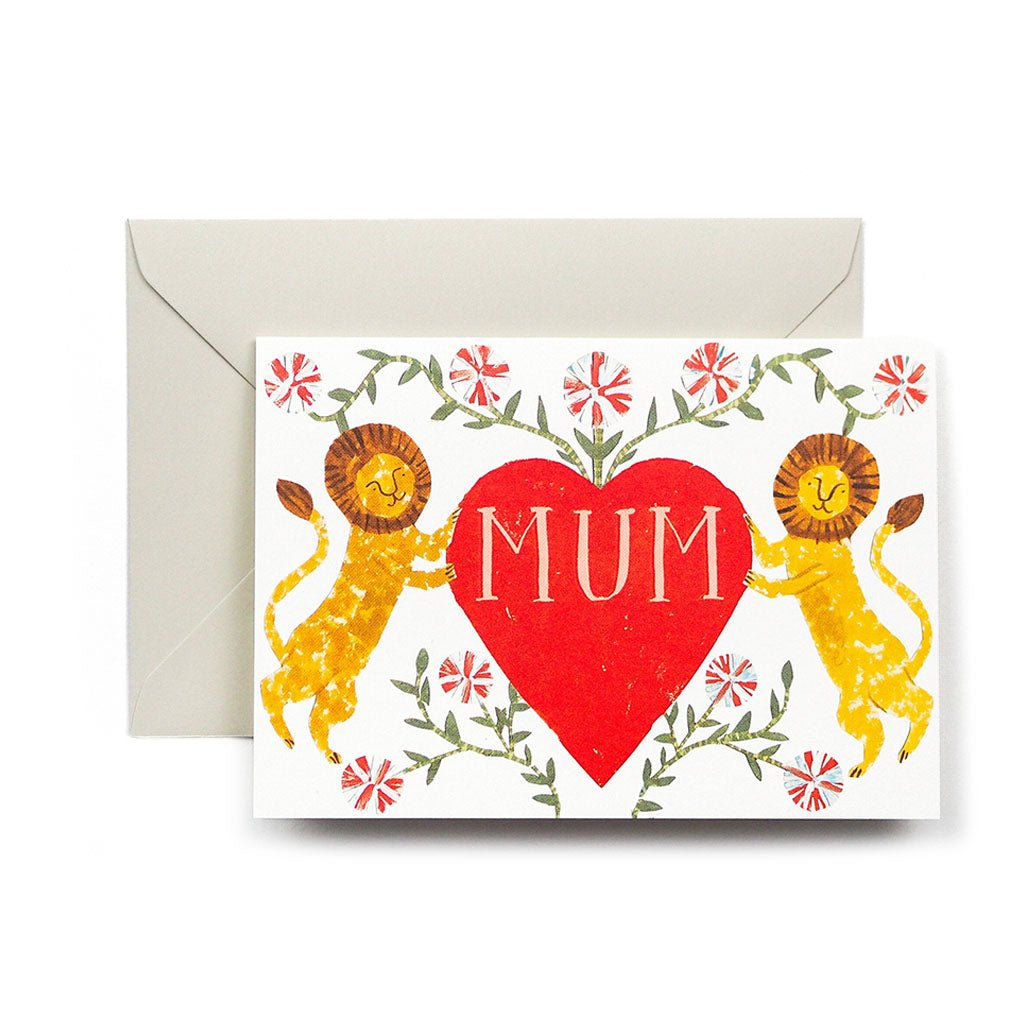 A mother's day greeting card with two lions around a red heart with "Mum" in the center with beige envelope on white background