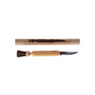 Wooden mushroom brush with knife next to packaging on white background