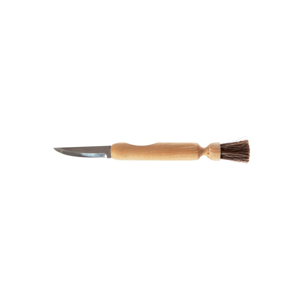 Wooden mushroom brush with knife on white background