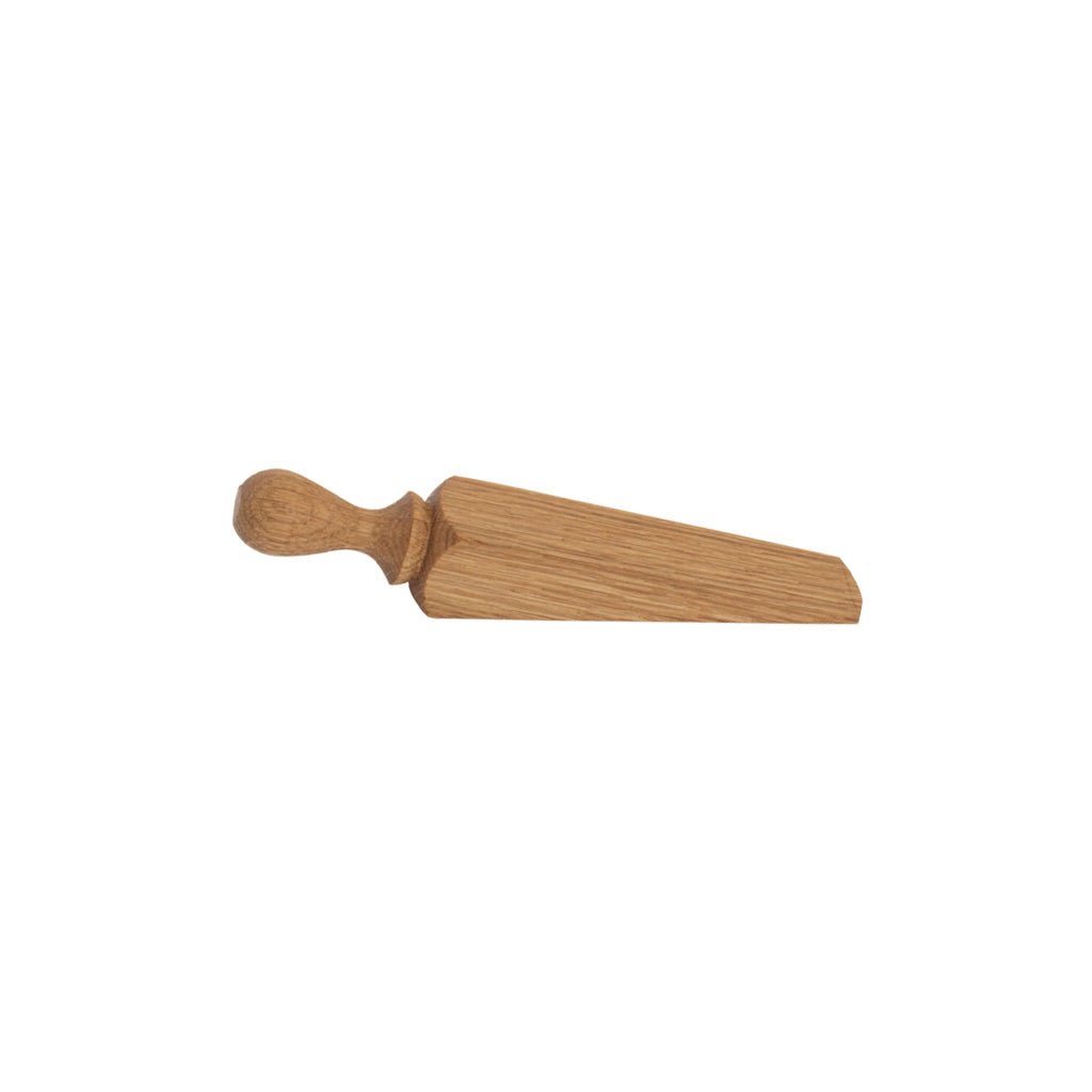 Oiled oak wood door stop on white background