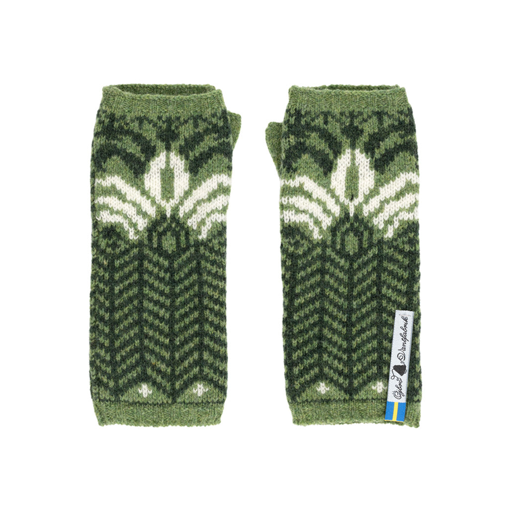 Outside pattern of green knit wool wristwarmers with white details.
