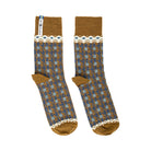 A pair of yellow and blue patterned merino wool socks.