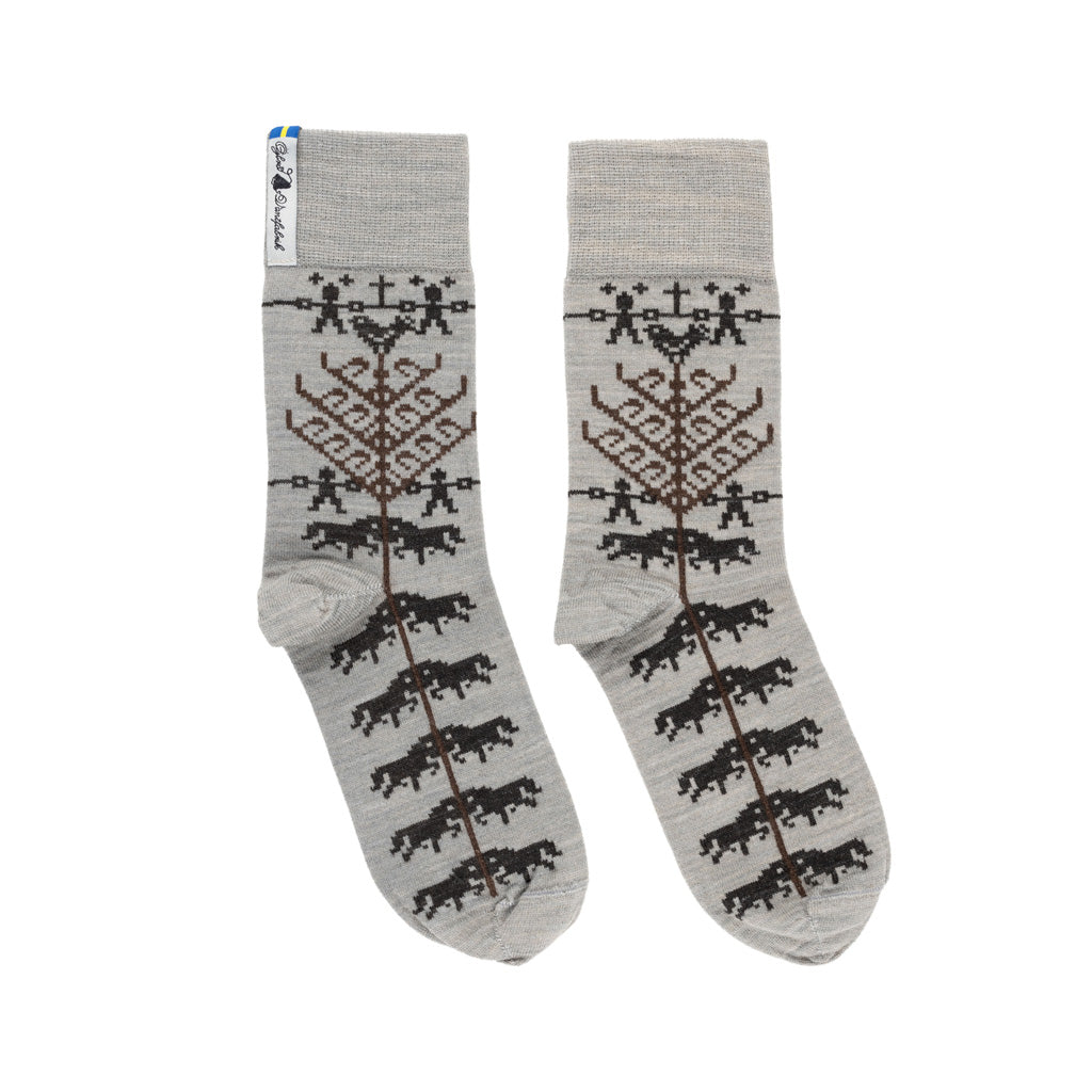 A pair of grey and black patterned merino wool socks.