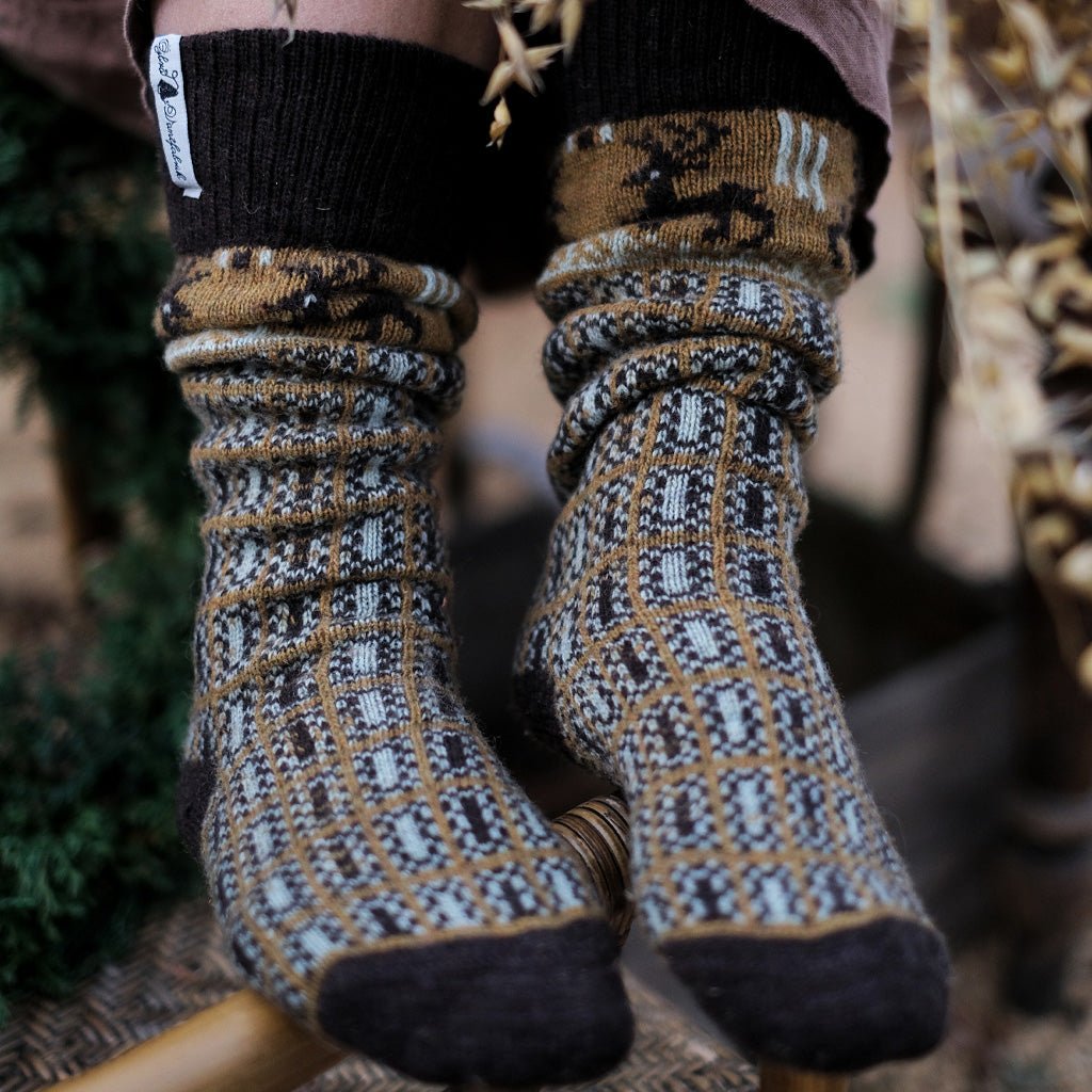Close-up of model wearing patterned wool socks.