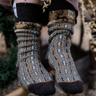 Close-up of model wearing patterned wool socks.