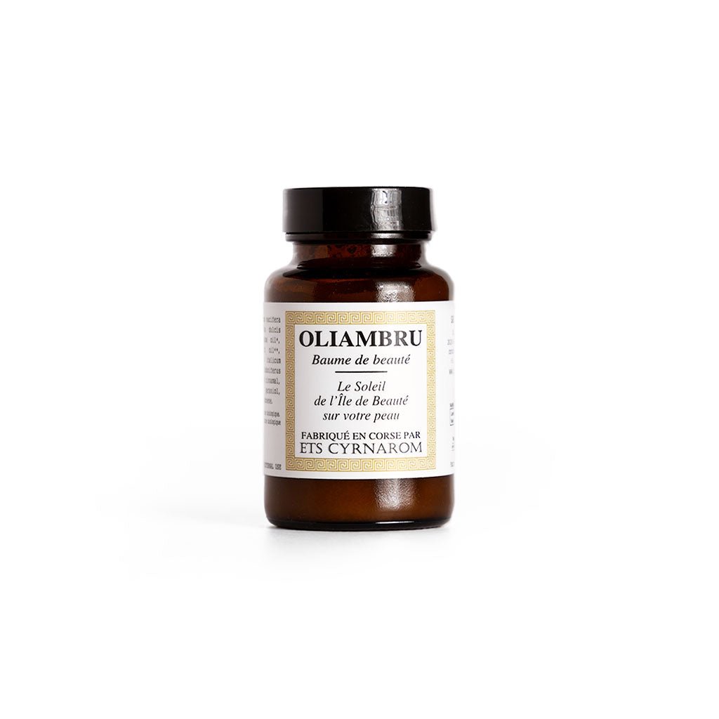 Amber jar of Oliambru Beauty Balm on white background