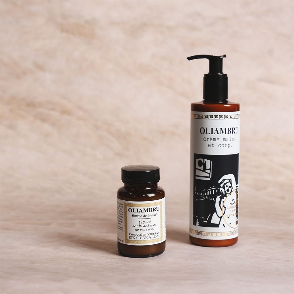 Two Oliambru products on a wooden surface