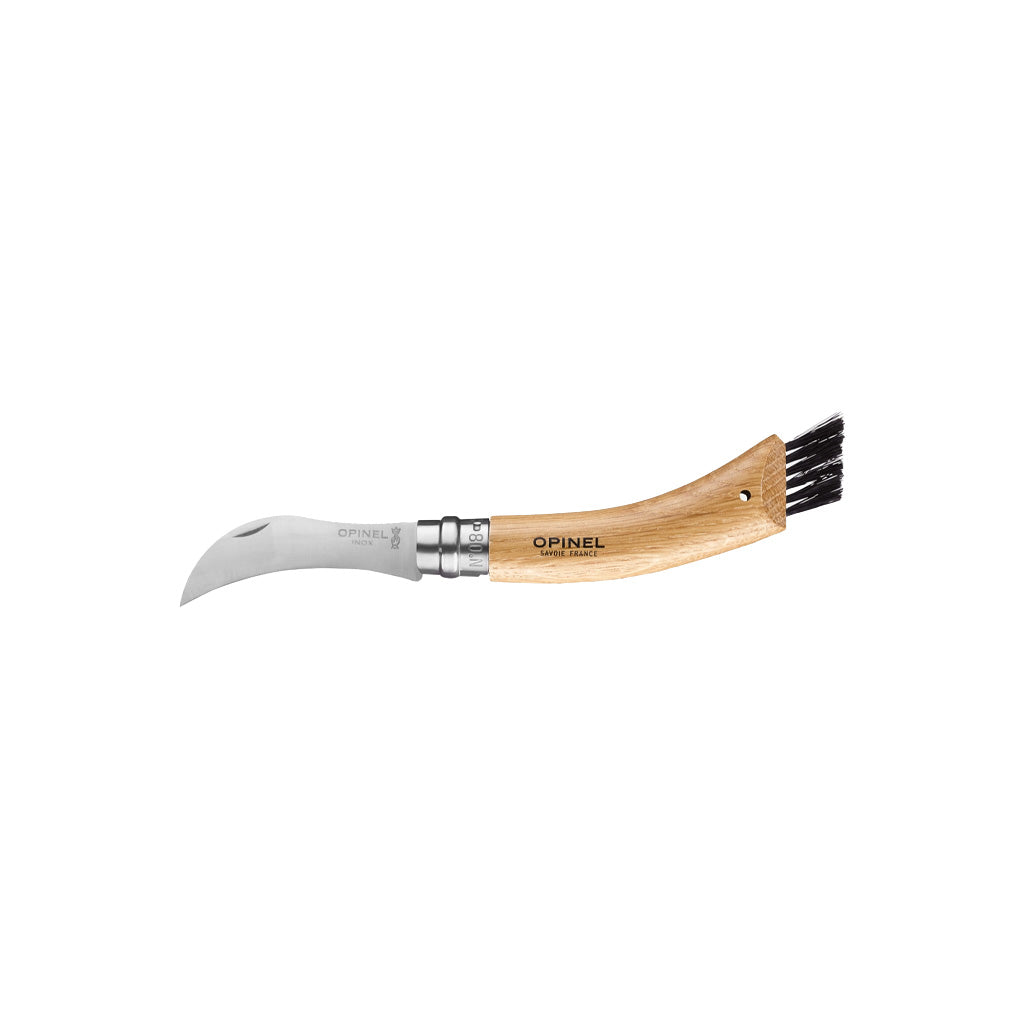 An Opinel curved mushroom knife with a stainless steel blade and a light-colored wooden handle featuring black cleaning bristles on the end, shown against a plain white background.