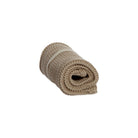 A rolled-up beige knitted washcloth on white background