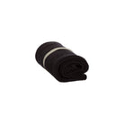 A rolled-up grey knitted washcloth on white background