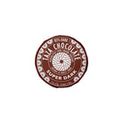 Taza Chocolate Super Dark stone ground chocolate disc in packaging on a white background