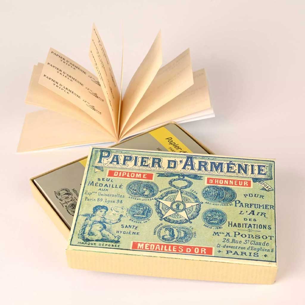 Vintage gift box set of Tradition incense paper booklets from Papier d'Armenie on light background