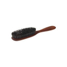 Pearwood hairbrush with dark boar bristles on white background