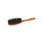 Small pear wood hairbrush with dark boar bristles on white background
