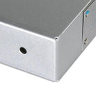 Close up of corner of steel tape dispenser with mounting hole