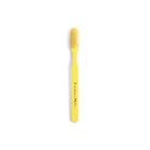Yellow striped toothbrush on white background