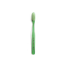 Green and clear striped toothbrush on white background