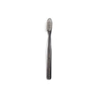 Black and clear striped toothbrush on white background