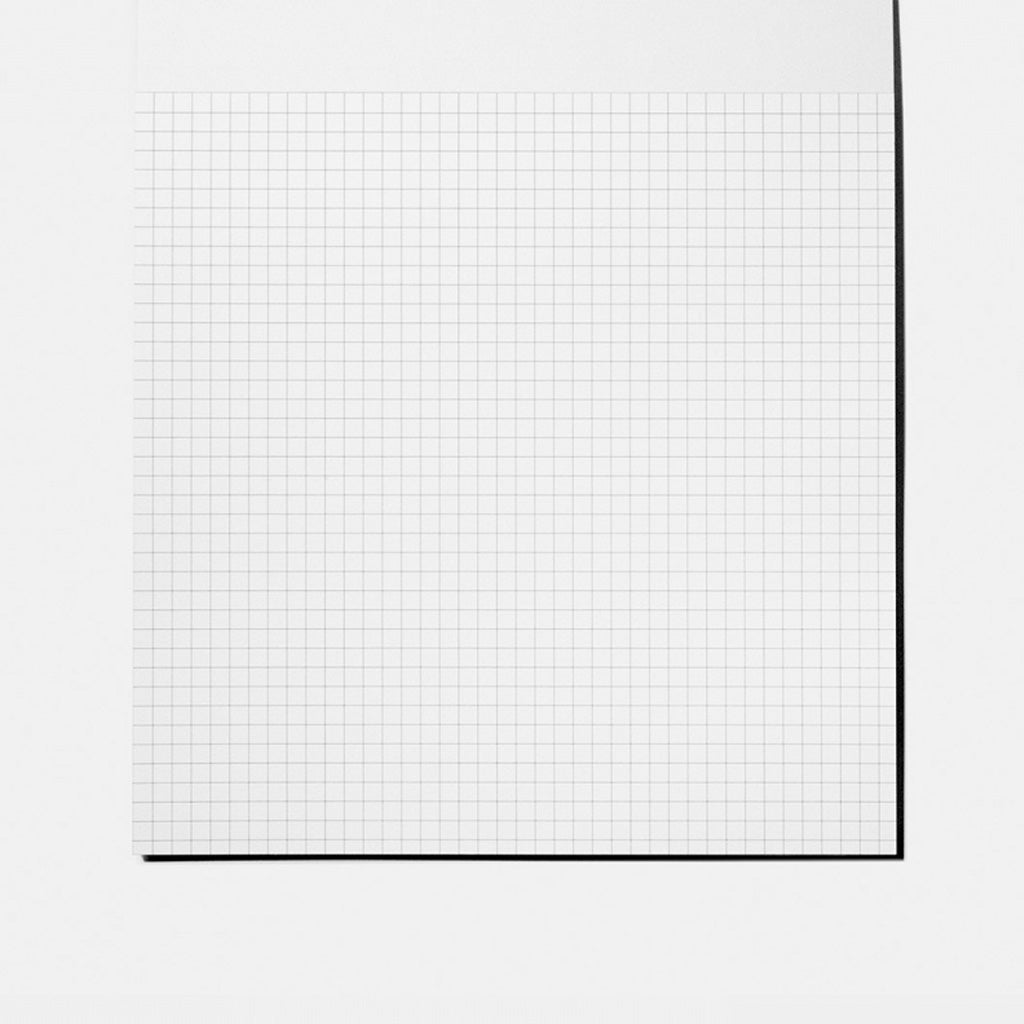 Sheet of gridded paper on white background