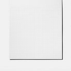 Sheet of gridded paper on white background