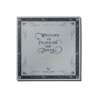 A gray square plain practice paper pad with "Writing Is Thinking On Paper" design against white background
