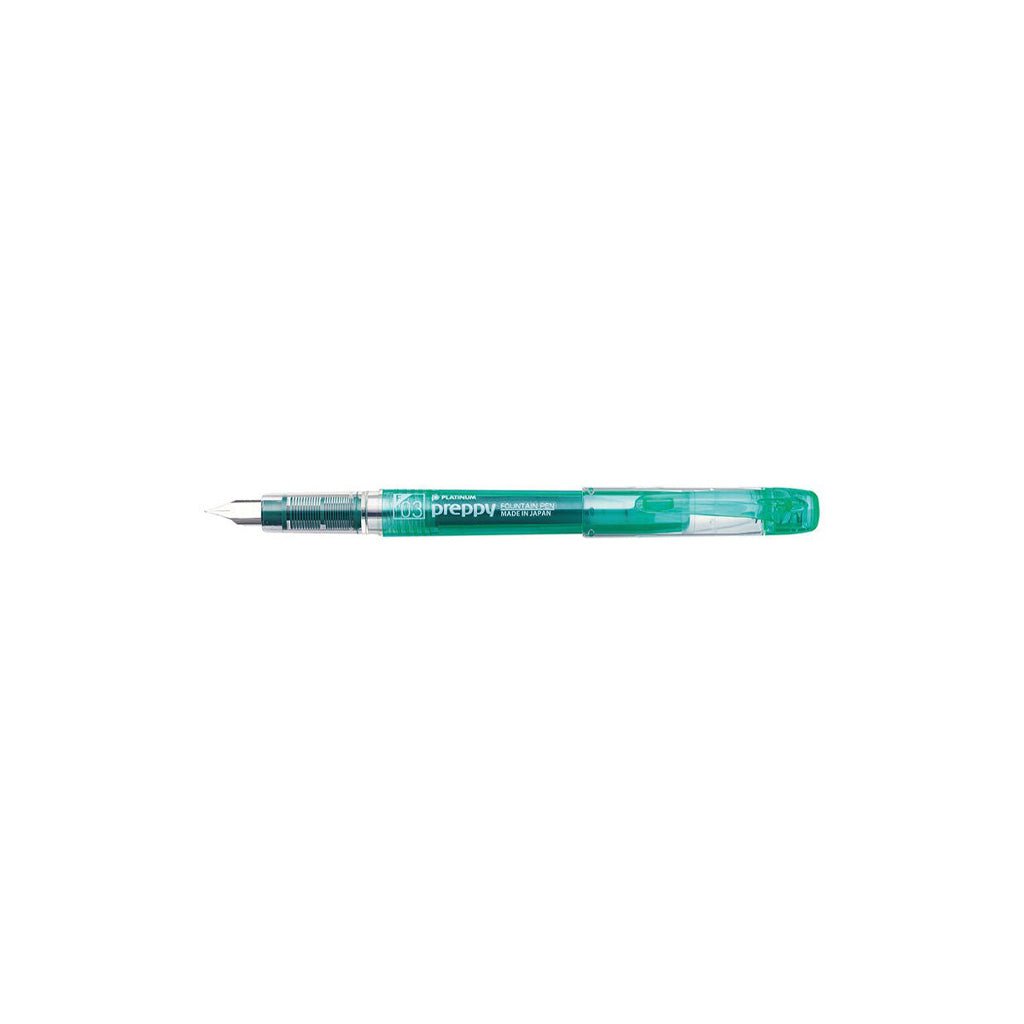 Green fountain pen on a white background